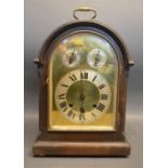 A Late Victorian, Early Edwardian Oak Dome Shaped Mantle Clock with brass carrying handle, the brass