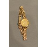 A 9ct. Gold Cased Ladies Wrist Watch By Tissot With Associated 9ct. gold strap, 14.7g all in