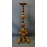 An 18th Century Style Gilt Wood Torchere Of Shaped Polychrome Form, highlighted with gilt with