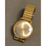 An Accurist 9ct. Gold Cased Gentleman's Wrist Watch with associated strap