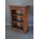 A Victorian Oak Pier Cabinet With A Moulded Top Above Open shelves, raised upon a plinth, 75cm wide,