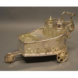 A Silver Plated Cruet Stand In The Form Of A Chariot