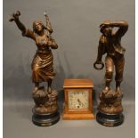 A Walnut Mantle Clock With A Single Train Movement, together with a pair of patinated spelter