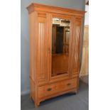 A Late Victorian Walnut Wardrobe The Moulded Cornice Above A Mirrored Door and a drawer, together