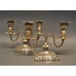 A Pair Of Victorian Silver Two Branch Dwarf Candlesticks with shaped bases, London 1892, 16cm tall