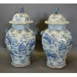 A Pair Of Chinese Under Glazed Blue Decorated Large Covered Vases Of Octagonal Form, 66cm tall