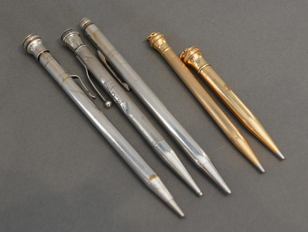 A Gold Plated Propelling Pencil Together With Another Similar, a silver cased propelling pencil