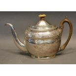 A George III Silver Teapot With Engraved Decoration and with shaped handle, London 1802, makers mark
