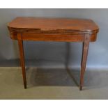 A 19th Century Mahogany Card Table, The Hinged Top enclosing a beige lined interior above a plain