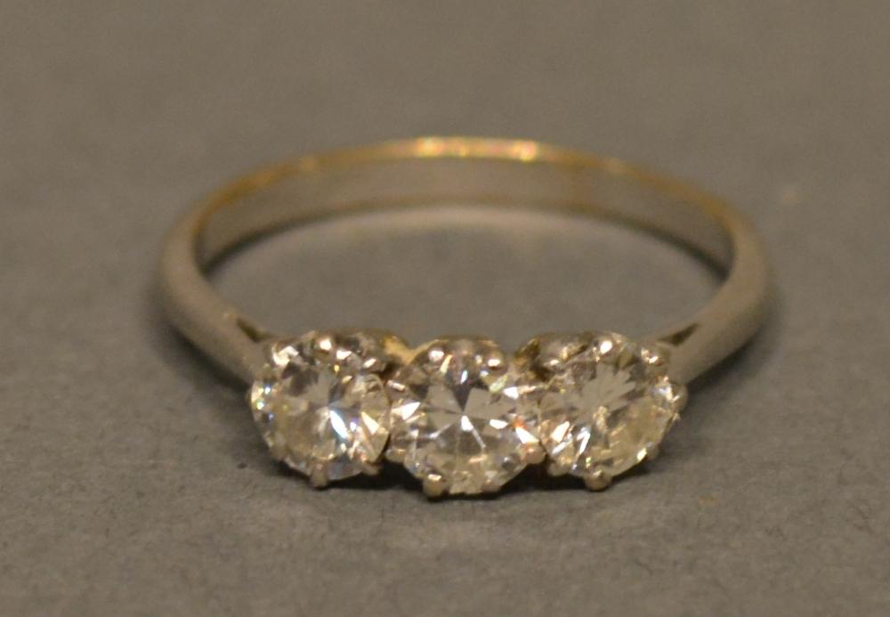 A White Metal Three Stone Diamond Ring Claw Set