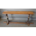 A Victorian Oak Window Seat With Wrought Iron Supports and oak stretcher, 147cm wide