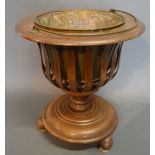 An Oak Jardiniere Of Lattice Form On Circular Pedestal Base