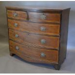 A 19th Century Mahogany And Inlaid Bow Fronted Chest of two short and three long drawers with