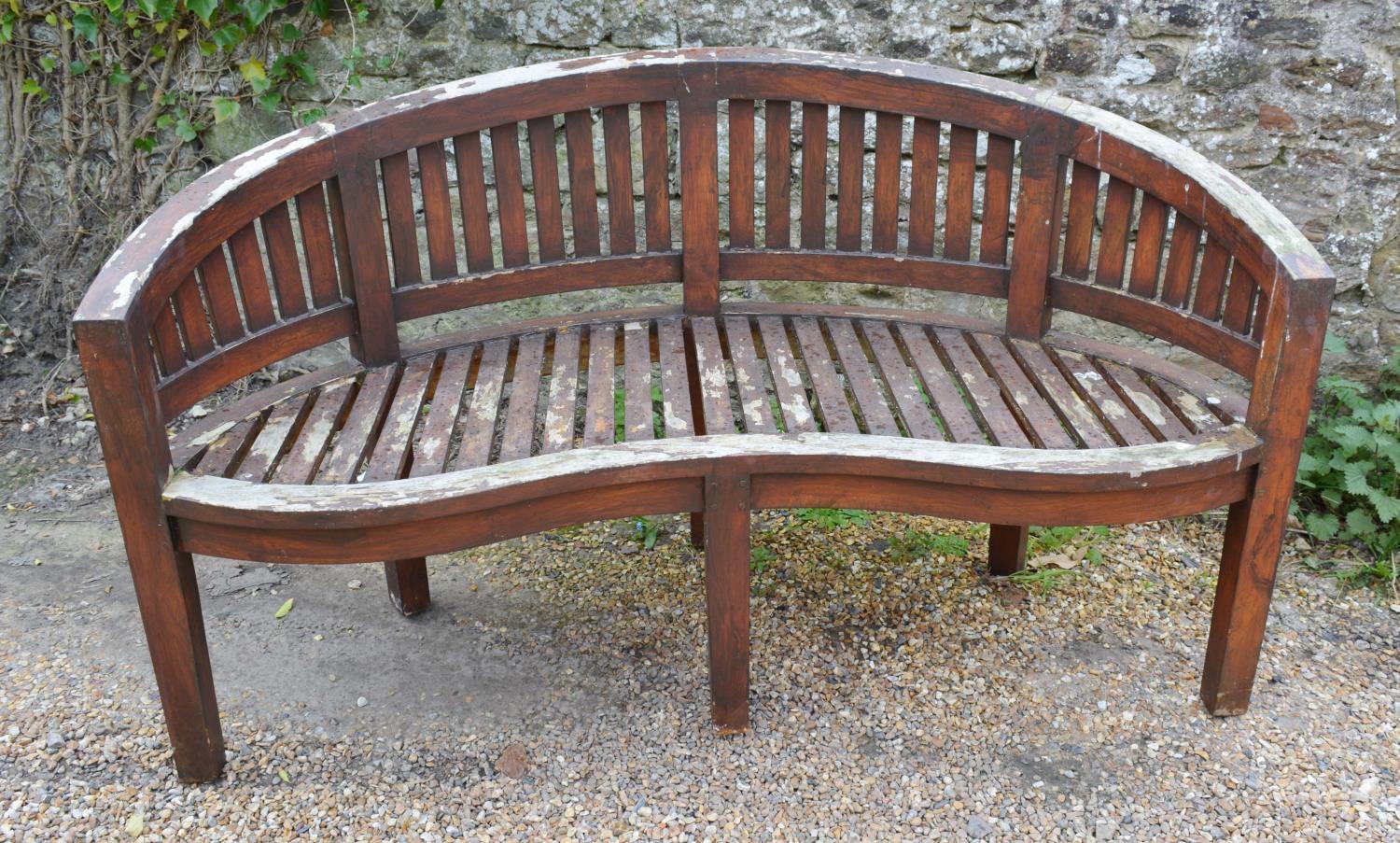 A Teak Garden Bench Of Serpentine Form With Square Legs, together with a rectangular refectory style