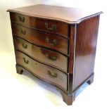 A George III Mahogany Serpentine Commode, The Moulded Top above four long drawers with brass