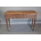 A George III Oak Rectangular Side Table, The Moulded Top Above An Arcadian Carved Frieze, raised