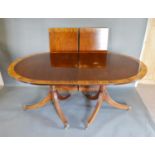 A Mahogany Extending Dining Table By Millwood Cabinet Makers, the crossbanded and reeded top above