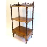 A Victorian Rosewood Three Tier Whatnot The Pierced Galleried Top above three serpentine shelves