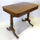 An Early 19th Century Mahogany Library Table Of Rectangular Form with a frieze drawer, raised upon