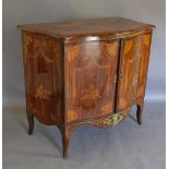 A 19th Century French Marquetry Inlaid And Gilt Metal Mounted Serpentine Commode, with two doors
