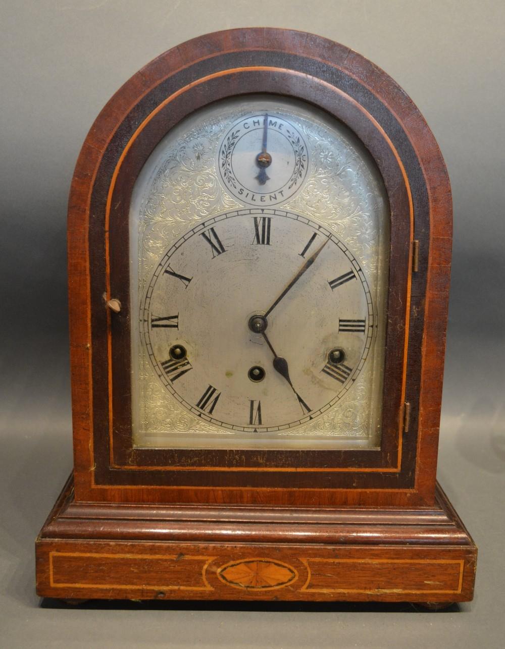 A Late Victorian, Early Edwardian Mahogany Line And Shell Inlaid Dome Shaped Mantle Clock, the