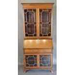 An Edwardian Mahogany Satinwood Inlaid Bureau Bookcase, the moulded cornice above two astragal