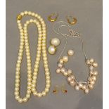 A Cultured Pearl Necklace, together with another similar, a pair of 14 carat gold ear studs and