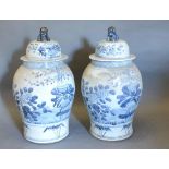 A Pair of Chinese Large Underglaze Blue Decorated Oviform Covered Vases, 63 cms tall