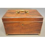 A George III Mahogany Tea Caddy, the hinged cover with brass handle enclosing a fitted interior with