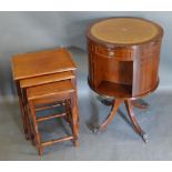 A Reproduction Mahogany Drum Table, together with a nest of three mahogany occasional tables