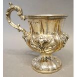 A William IV Silver Mug of Embossed Foliate Form, with shaped handle, London 1835, 5oz