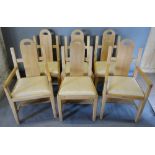 A Set of Six Arts and Crafts Dining Chairs, each with a shaped back above a drop in seat raised upon