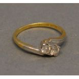 An 18 Carat Gold and Platinum Diamond Crossover Ring