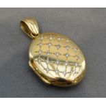 An 18 Carat Gold Oval Locket With Diamonds, 10.9 grammes