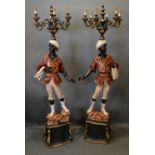 A Pair Of Blackamoor Floor Standing Six Branched Candelabrum of figural form with serpentine
