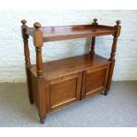 A Victorian Mahogany Buffet With A Low Galleried Top Above Two Panel Doors, with turned supports,