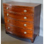 A 19th Century Mahogany Bow Fronted Chest of Drawers, the reeded top above four long drawers with