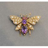 A 9 Carat Gold Small Brooch in the form of a butterfly set amethyst, pearls and rubies, 2.5cm wide
