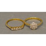 An 18 Carat Gold Diamond Cluster Ring, together with a similar 18 carat gold five stone diamond ring