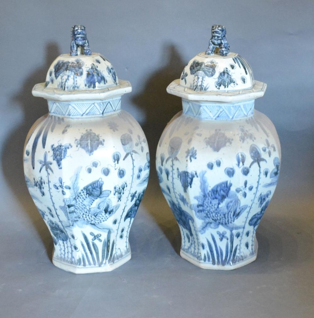 A Pair of Chinese Underglaze Blue Decorated Covered Vases of Octagonal Oviform, 65 cms tall