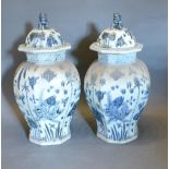 A Pair of Chinese Underglaze Blue Decorated Covered Vases of Octagonal Oviform, 65 cms tall