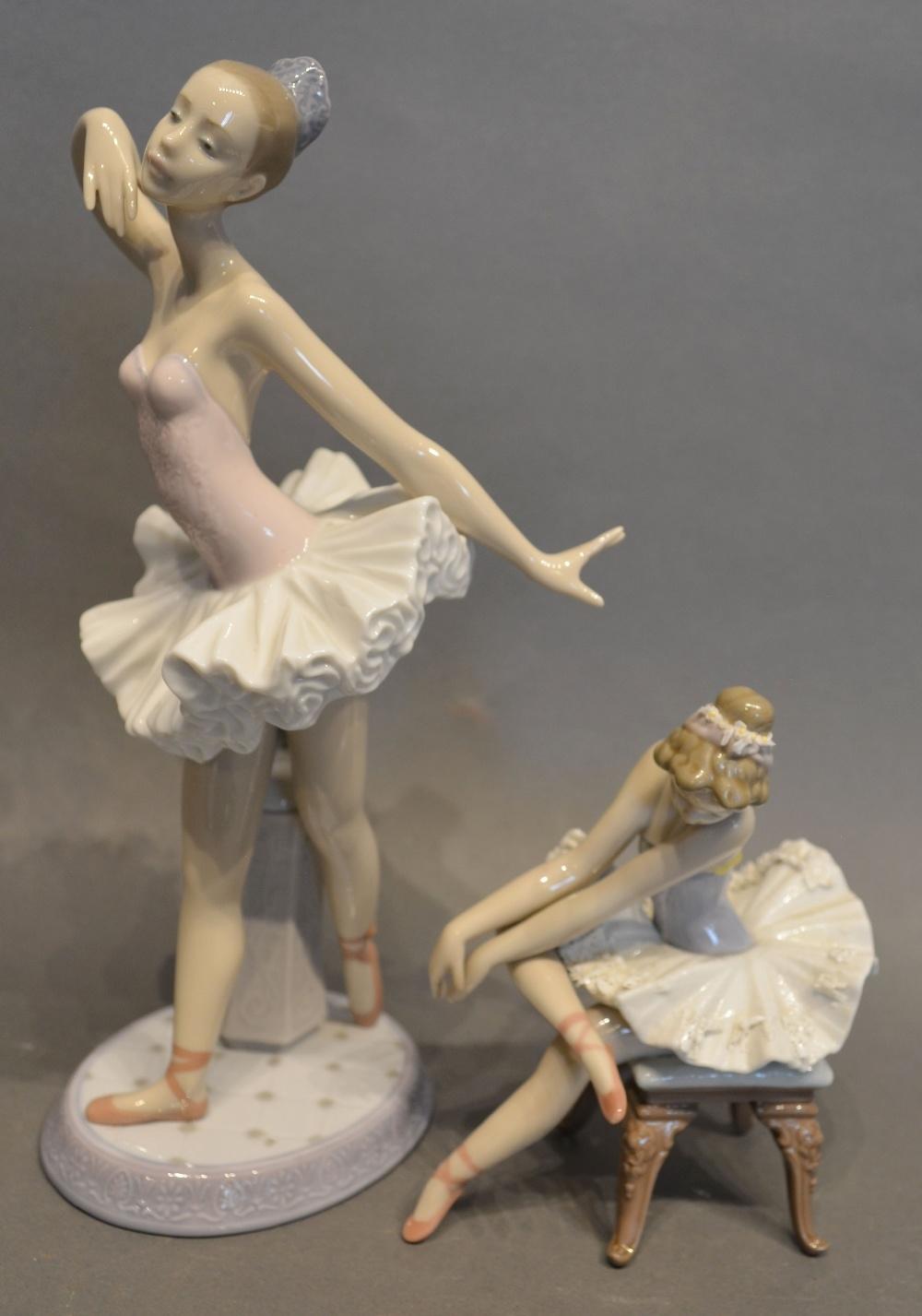 A Lladro Porcelain Model of a Ballerina, together with another similar, seated