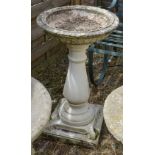 A Weathered Concrete Bird Bath with square pedestal base, 70cm tall, together with similar weathered