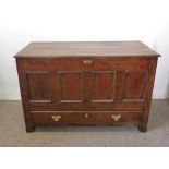 A George III Oak Mule Chest The Hinged Top Above A Four Panel Front above a drawer with brass