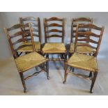 A Set Of Five 19th Century Country Ladder Back Dining Chairs With Rush Seats, raised upon turned