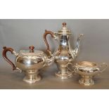A Silver Three Piece Tea Service comprising teapot, hot water pot and two handled sucrier, London