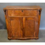 A Victorian Walnut Secretaire Side Cabinet Of Serpentine Form, the moulded top above a fully