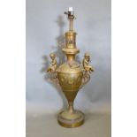 A 19th Century Table Lamp of Urn Form mounted with Putti upon a Circular Pedestal Base, 60 cms tall
