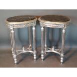 A Pair Of French Silvered Oval Tables, each with a variegated marble inset top above a carved