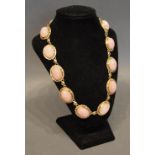 A 9 Carat Yellow Gold Necklace set with cabochon rose quartz panels